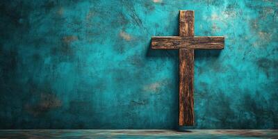 Wooden cross against a textured turquoise wall in a serene setting for reflection and meditation photo