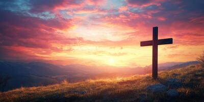 Sunset view featuring a wooden cross on a hill overlooking a valley with colorful skies in the background photo