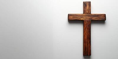 Wooden cross displayed on a simple white background conveying a sense of faith and spirituality in a serene environment photo