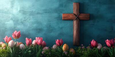 Vibrant Easter celebration with colorful eggs, blooming tulips, and a wooden cross against a textured blue background photo