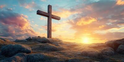 Beautiful wooden cross on rocky hillside against vibrant sunset with colorful sky and dramatic clouds photo