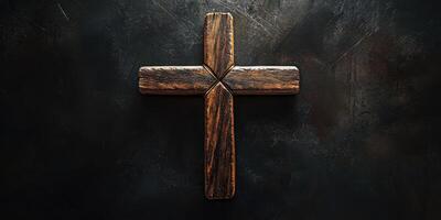 Rustic wooden cross on a dark background highlighting faith and spirituality photo
