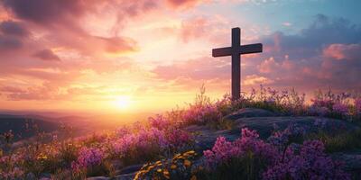 Sunset view of a cross surrounded by vibrant flowers atop a hill with a colorful sky in the background photo