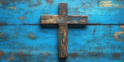 Rustic wooden cross on blue weathered surface showcasing craftsmanship and spirituality photo
