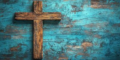 Rustic wooden cross against a textured turquoise background adds a spiritual touch to any space photo