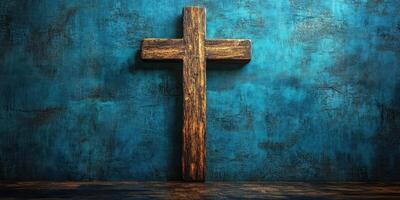 Wooden cross against a textured blue wall in a serene and reflective setting photo