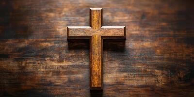 Wooden cross rests on a rustic table highlighting its simple elegance and symbol of faith and devotion photo