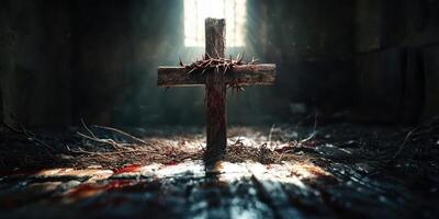 Dramatic portrayal of a wooden cross adorned with thorns in a dimly lit, abandoned space photo