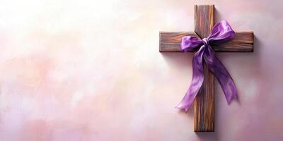 Wooden cross with purple ribbon ornament displayed on a soft textured background for religious occasions and celebrations photo