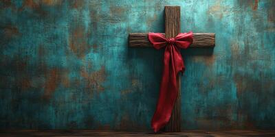 Rustic wooden cross with red bow against textured turquoise wall creates a serene and reflective atmosphere photo