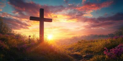 Sunrise over a cross in a serene landscape filled with flowers and a vibrant sky photo