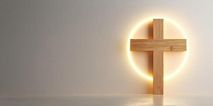Wooden cross illuminated by a soft glow against a neutral wall in a serene setting photo