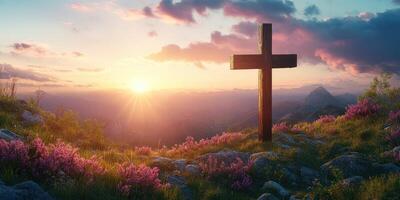 Sunrise over mountains with a wooden cross and blooming flowers in a serene landscape photo