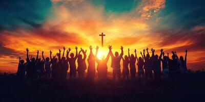 Community gathers at sunset to celebrate faith and unity near a cross in a serene outdoor setting photo