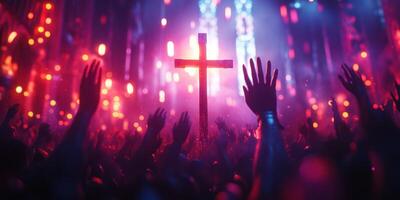 Vibrant display of worship and unity with raised hands and a cross in a lively atmosphere during an evening gathering photo