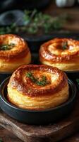 Savory pastry rolls baked to golden perfection with fresh herbs in a rustic kitchen photo