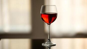 Red Wine In Wine Glass On Table photo