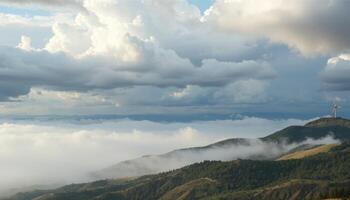Misty Mountain Range Under Dramatic Sky photo