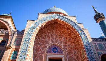 Ornate Mosque Entrance with Blue and Red Tilework Under a Clear Sky photo