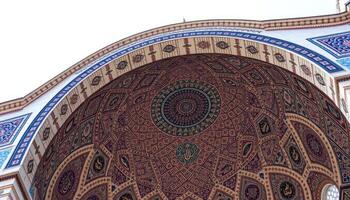 Ornate Mosque Archway with Blue and Brown Mosaic Tiles photo