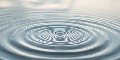 Circular ripples emanate from a point on water surface photo