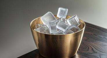 A gold bucket with ice cubes in it photo