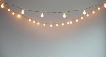 A string of lights is lit up and is hanging from the ceiling. photo