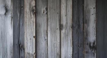 Rustic weathered wooden planks create a textured grey background. photo