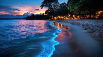 Magical Bioluminescent Waves on Tropical Beach at Sunset Illuminated Shore photo