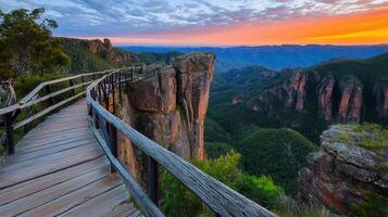 Majestic Sunset View from a Clifftop Wooden Walkway in a Canyon Landscape photo