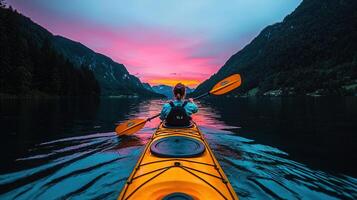 Serene Kayaking at Sunset Woman Paddling on Calm Lake Surrounded by Majestic Mountains photo