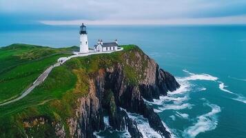Majestic Coastal Lighthouse on Dramatic Cliffs Ocean View Aerial Photography photo