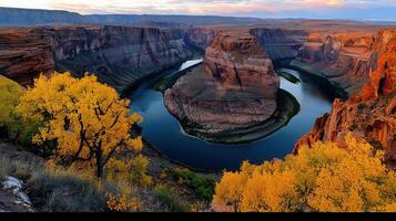 Majestic Horseshoe Bend Canyon River Landscape with Autumn Trees at Sunset photo