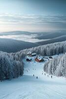 Mountain ski resort with snow-covered trees and skiers on slopes photo