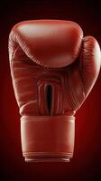Red boxing glove on dark background for sports and fitness concepts photo