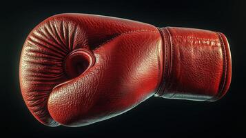 Close-up of a red boxing glove on a dark background photo