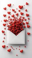 Red hearts escaping from white envelope on white background for valentine's day concept photo