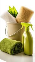 Green cleaning supplies with sponges and towels in a bucket photo
