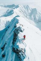 Skier on snowy mountain peak with snow-capped mountains in background photo