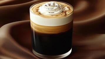 Close-up of a delicious layered coffee drink topped with whipped cream photo