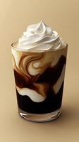 Creamy coffee layered drink with whipped topping in transparent glass photo