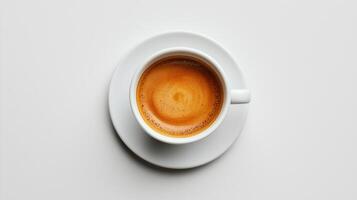 Close-up of a white coffee cup filled with fresh espresso on a saucer photo