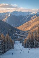 Skiers on a snowy mountain slope overlooking a resort with surrounding peaks photo