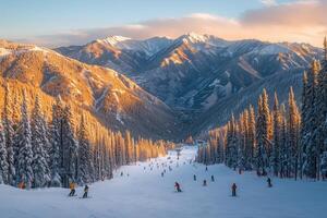 Skiers enjoying slopes in beautiful mountain landscape at sunrise photo