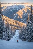 Winter ski resort with snow-covered slopes and mountain range at sunset photo