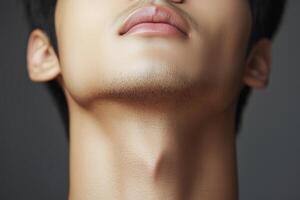 Close-up of male neck and chin with smooth skin and defined jawline photo