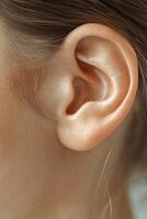 Close-up image of a human ear. Detailed view of the ear canal and outer structure photo