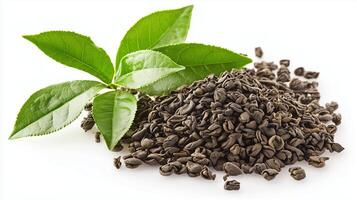 Close-up of tea leaves and dried tea seeds on white background photo