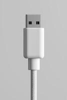 Close-up of a usb cable connector against a minimalist grey background photo