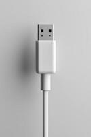 Close-up of a white usb cable connector against a light gray background photo